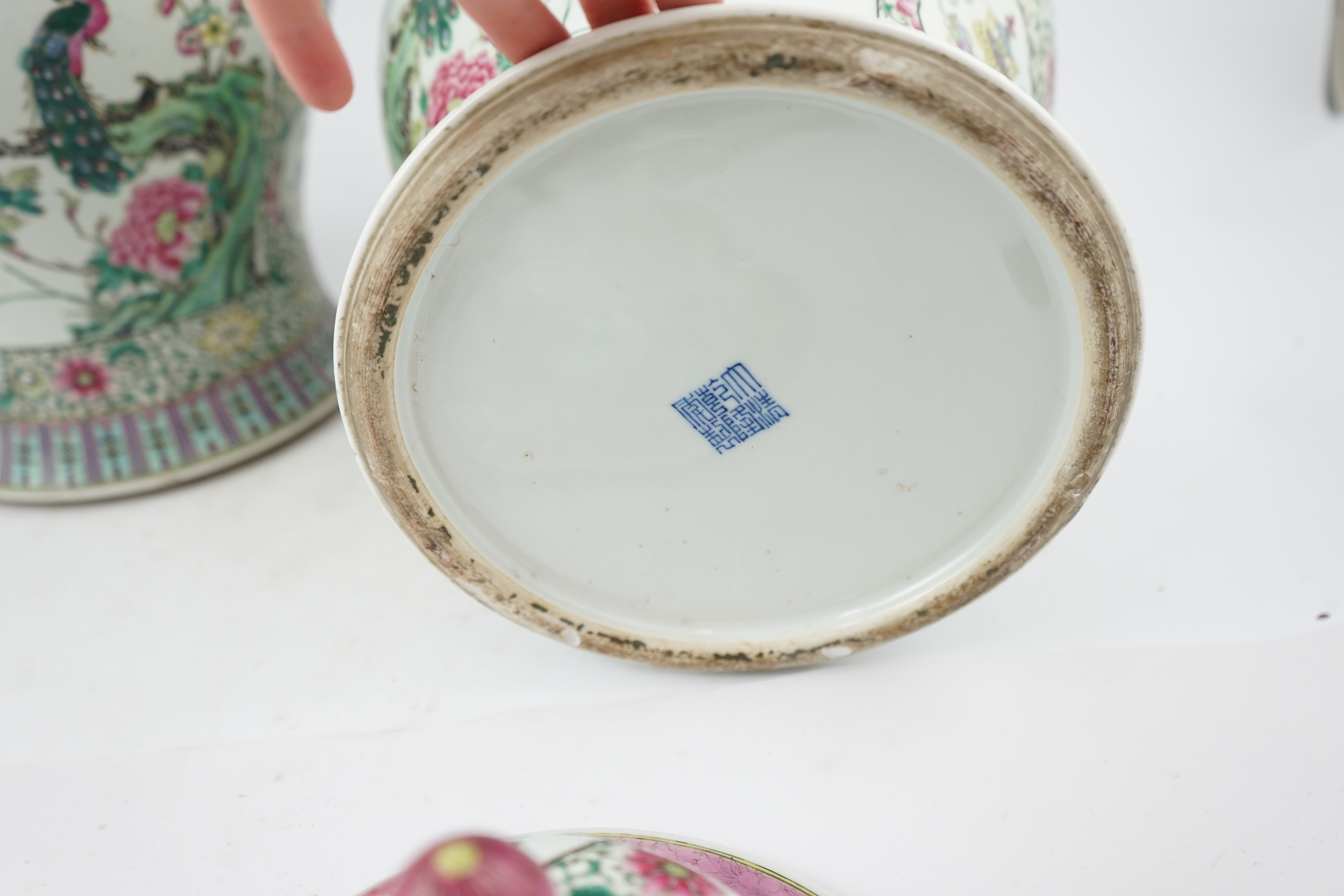 A pair of large Chinese famille rose baluster jars and covers, Qianlong seal mark, but late 19th century